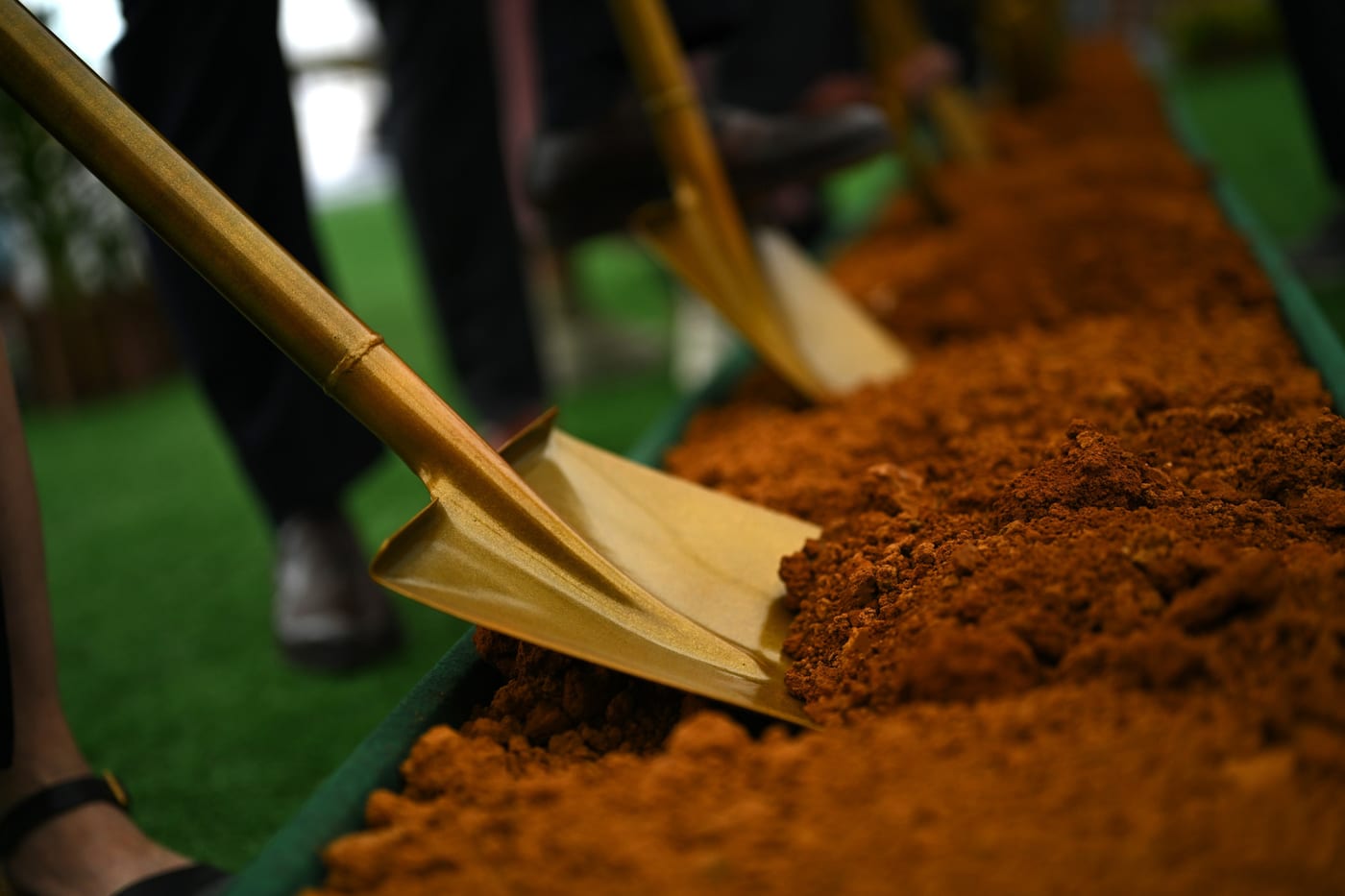 Ceremonial shovels turning the first soil at the Singapore Temple ground-breaking, 28 June 2025